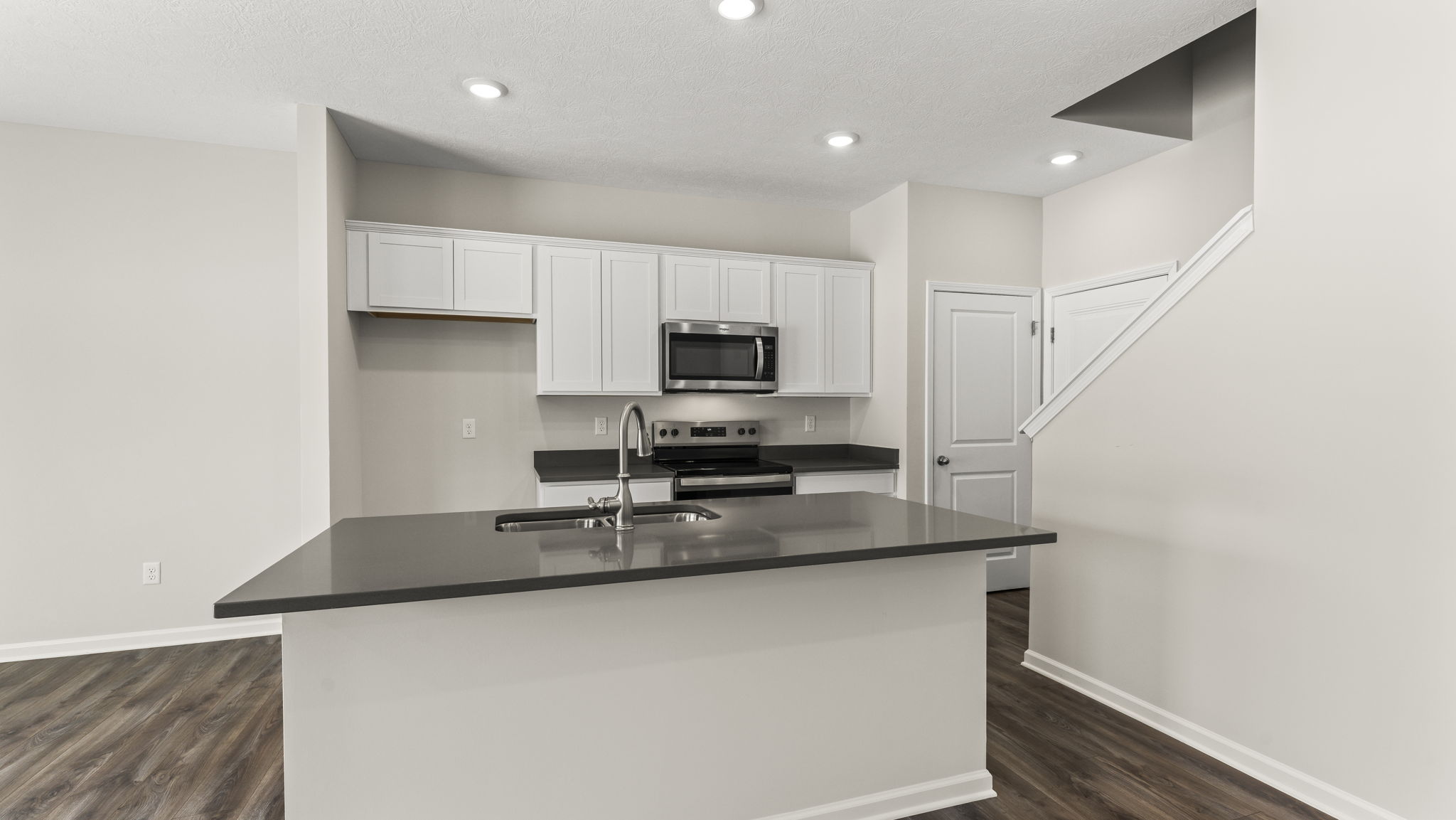 Three-quarter view of kitchen with island