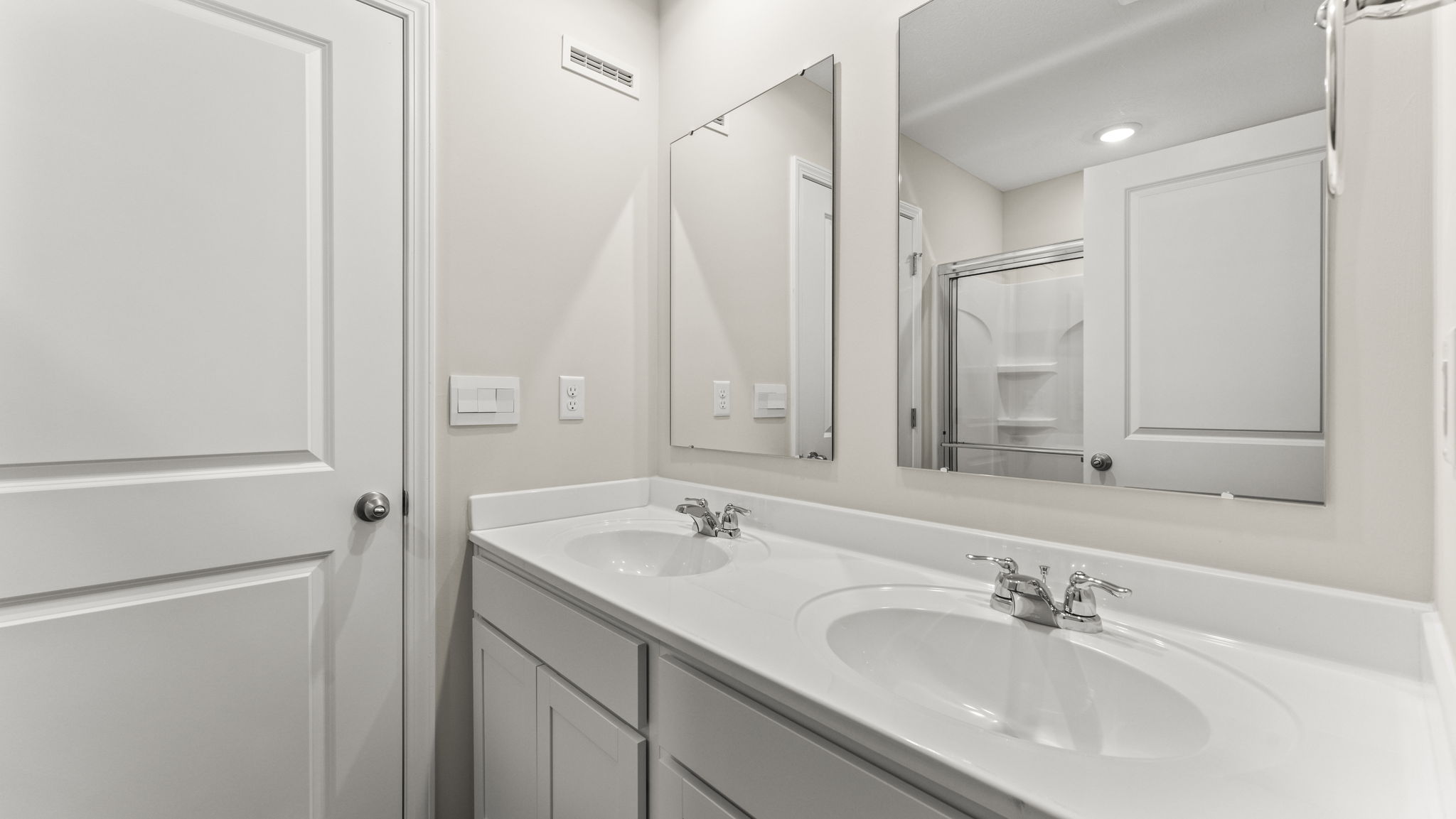 dual-sink vanity with two mirros