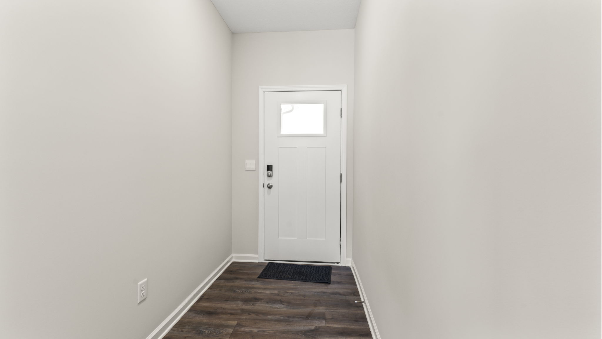 Front door of the home with window