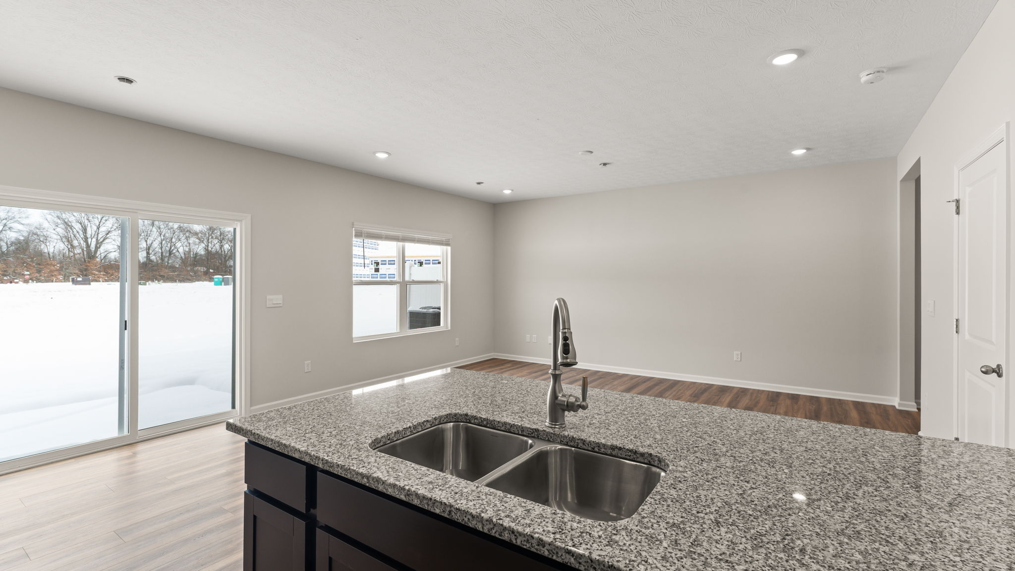 Perspective of the full great room from the kitchen sink.