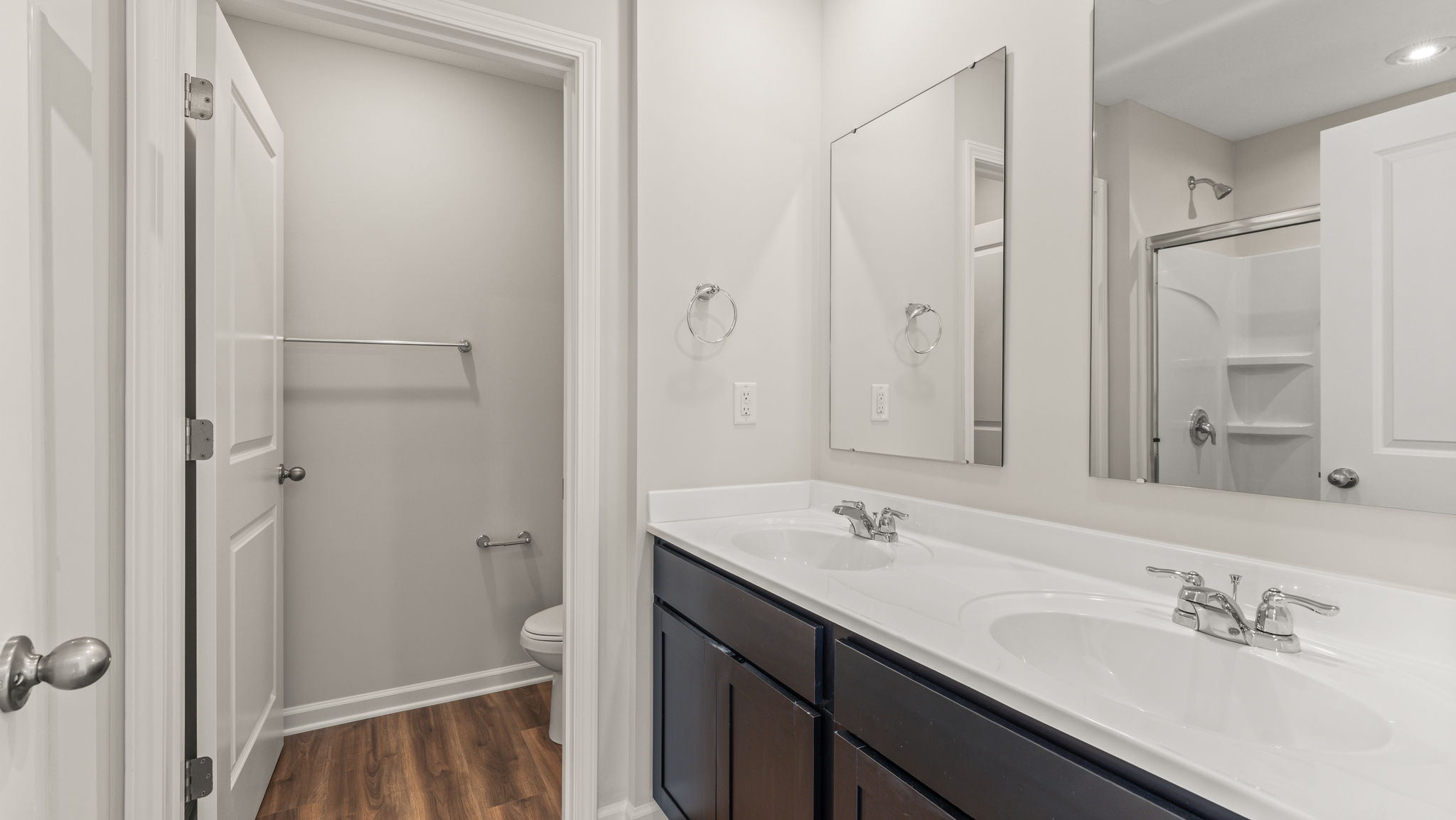 Closeup of bathroom vanity with two mirrors