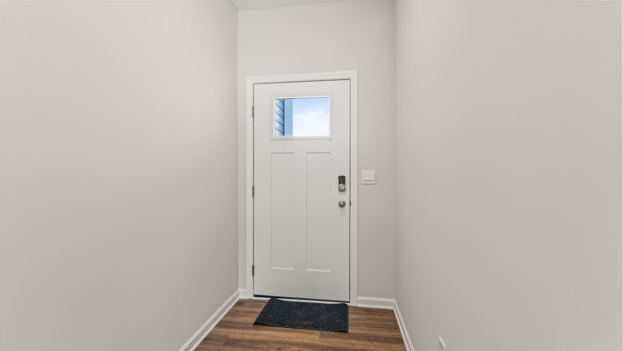 Front door of the home with window