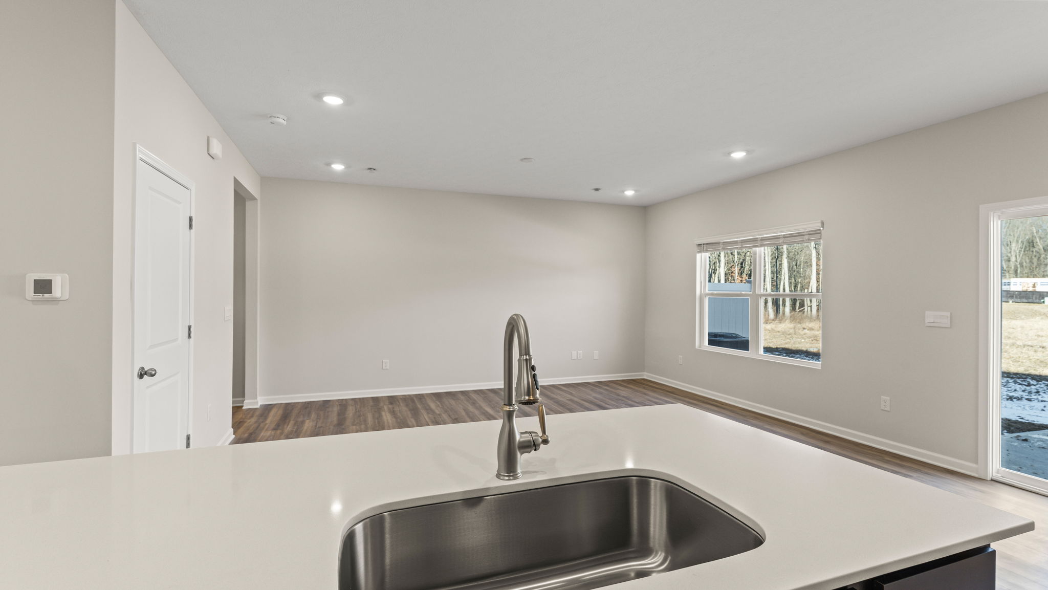 Closeup of sink and granite island