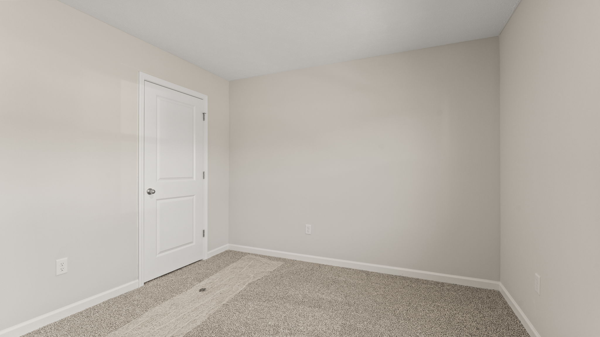 Carpeted bedroom with window