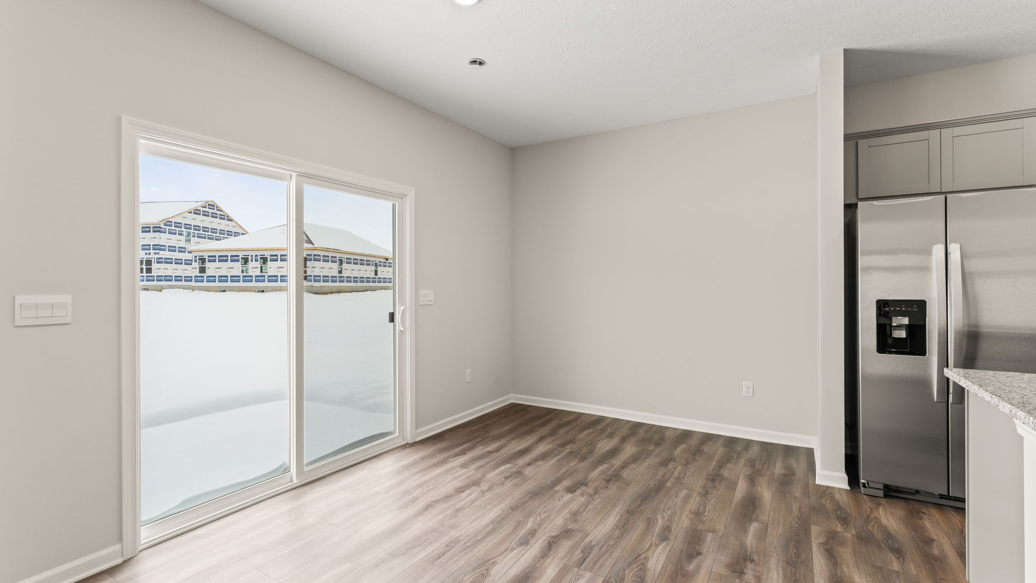 Dining area next to sliding door.