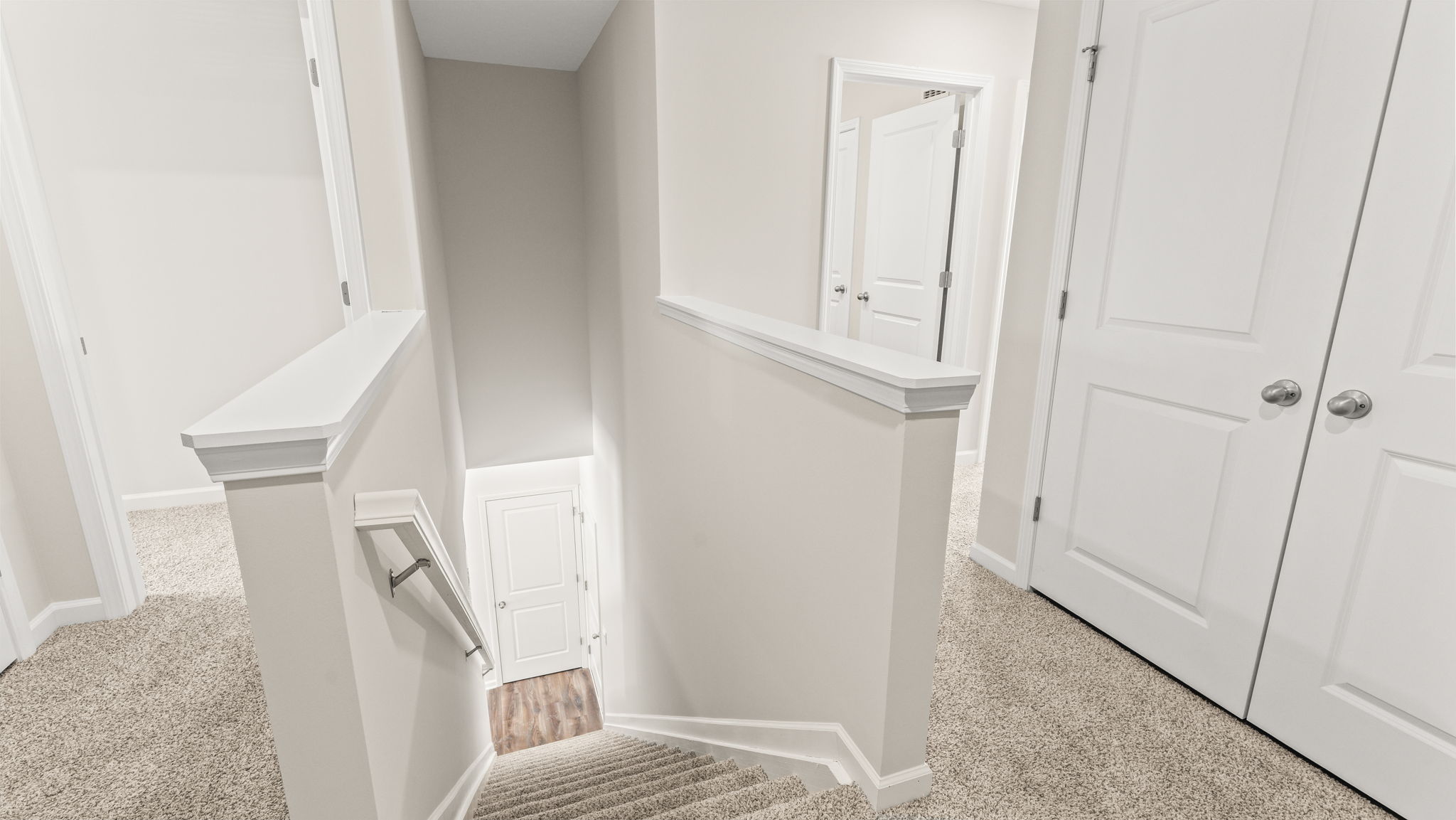 Upstairs landing with stairs leading to first level.