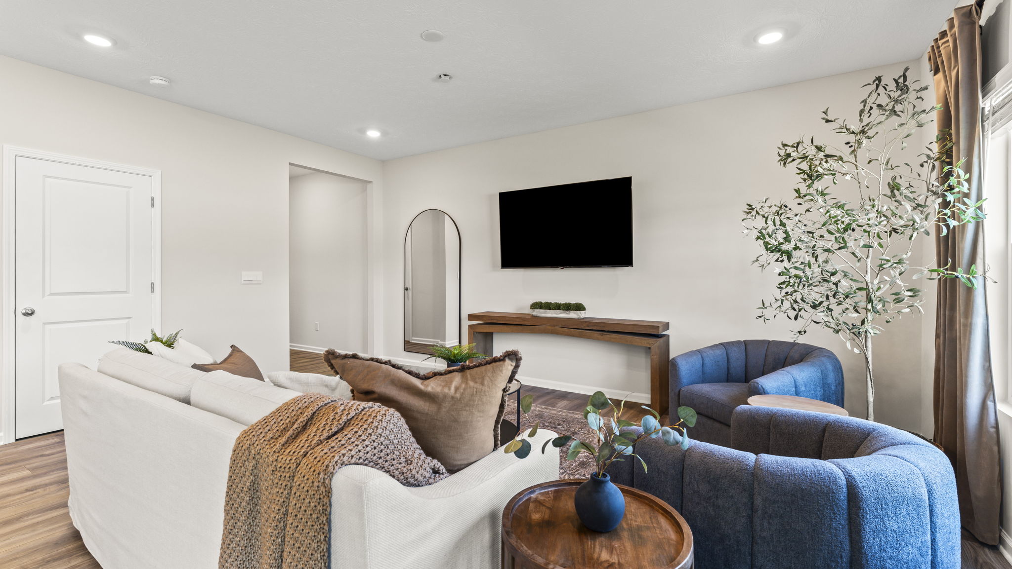 Living room with TV, center table, and modern furniture