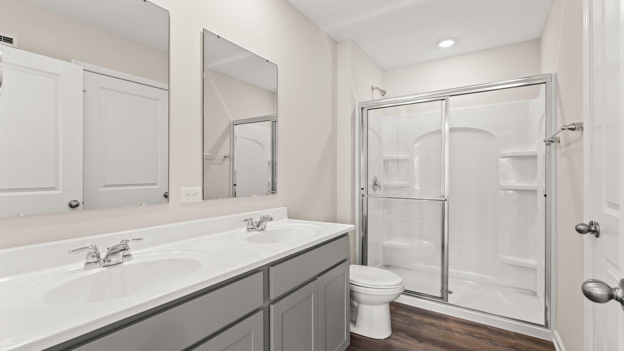 Wide angle of primary bathroom with dual-sink vanity