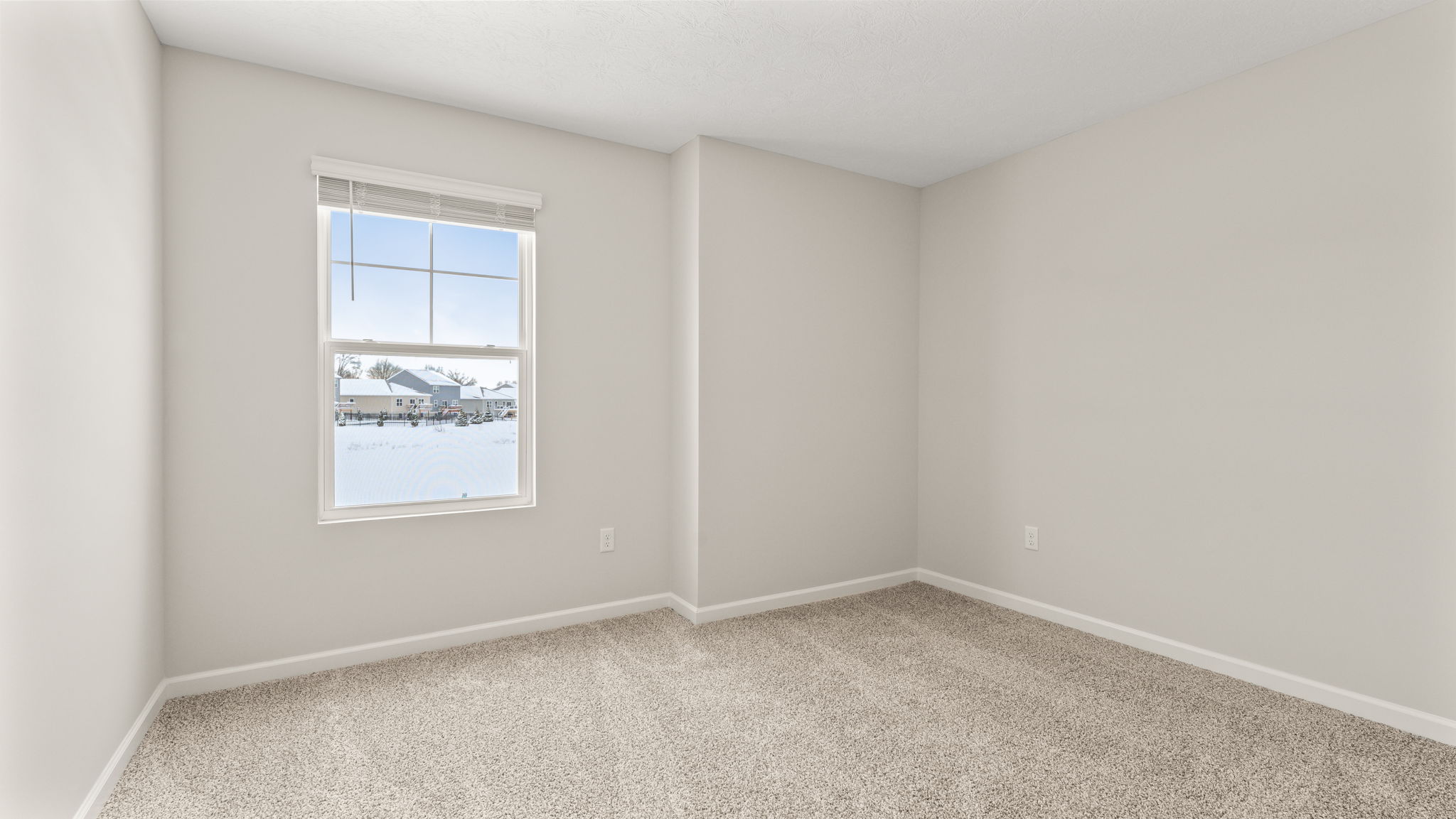 Carpeted bedroom with window