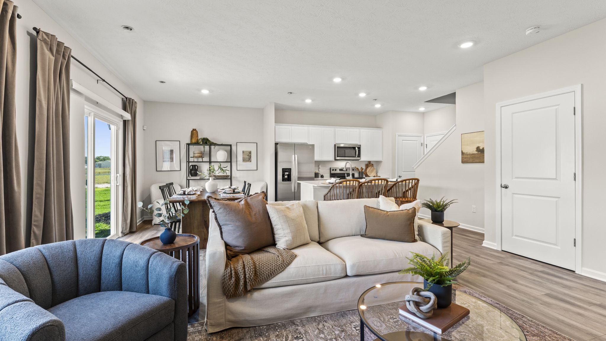 Living room furniture with view of kitchen