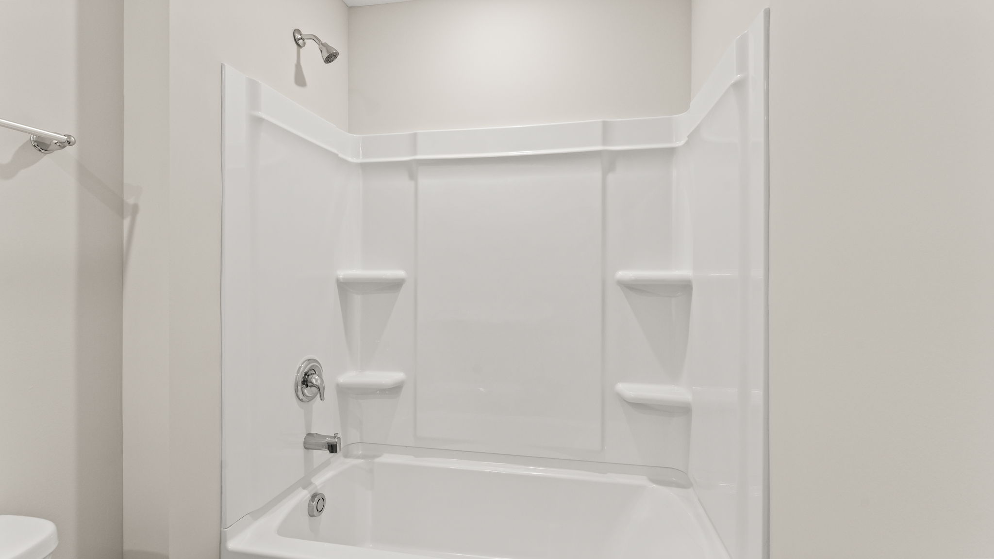 Closeup of tub with tiered shelving