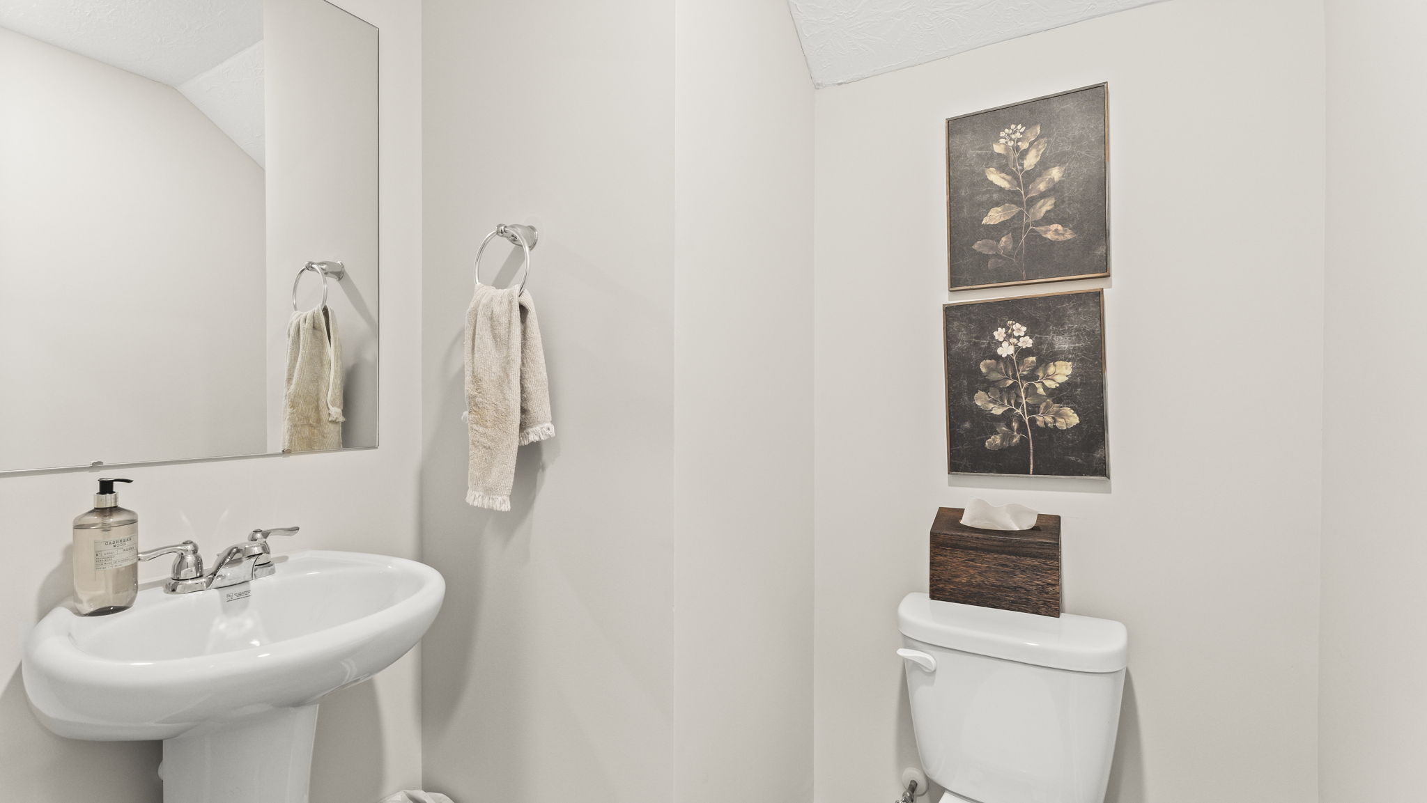 First floor powder room with art