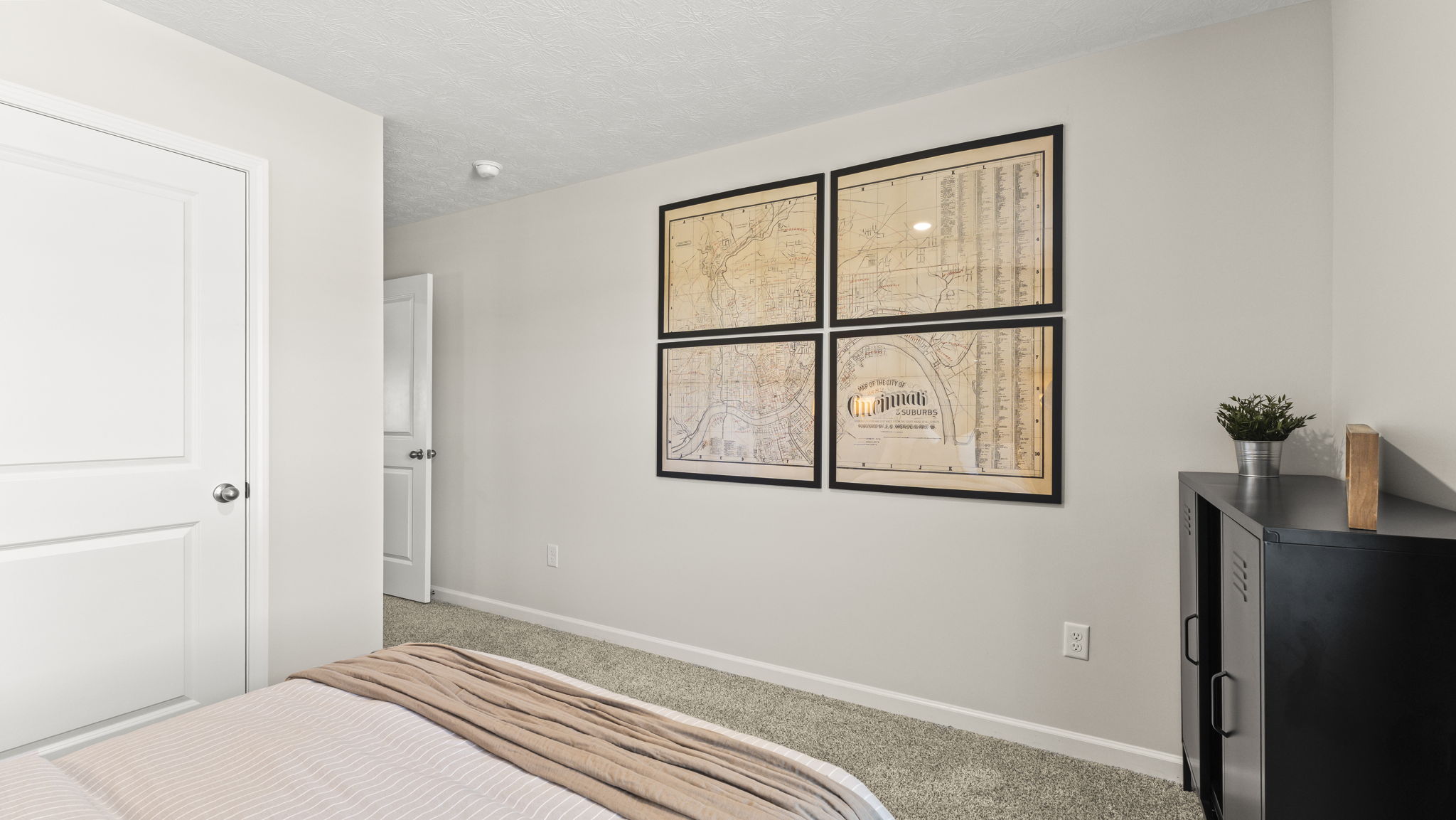 Locker-style cabinets and map of Cincinnati decoration in bedroom