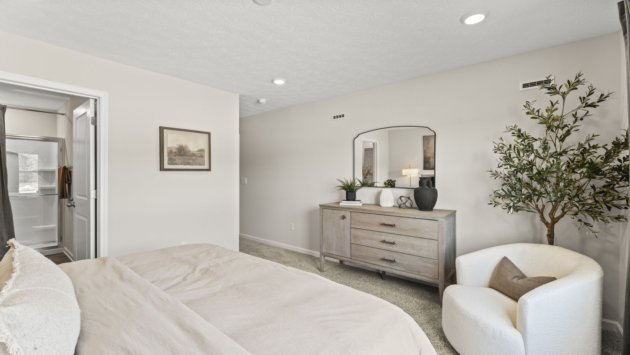 Primary bedroom with cottage style furniture