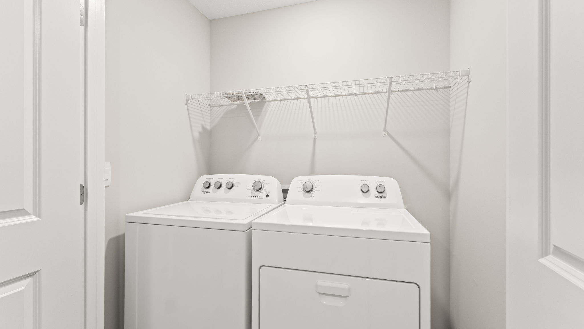 Laundry area with Whirlpool washer and dryer