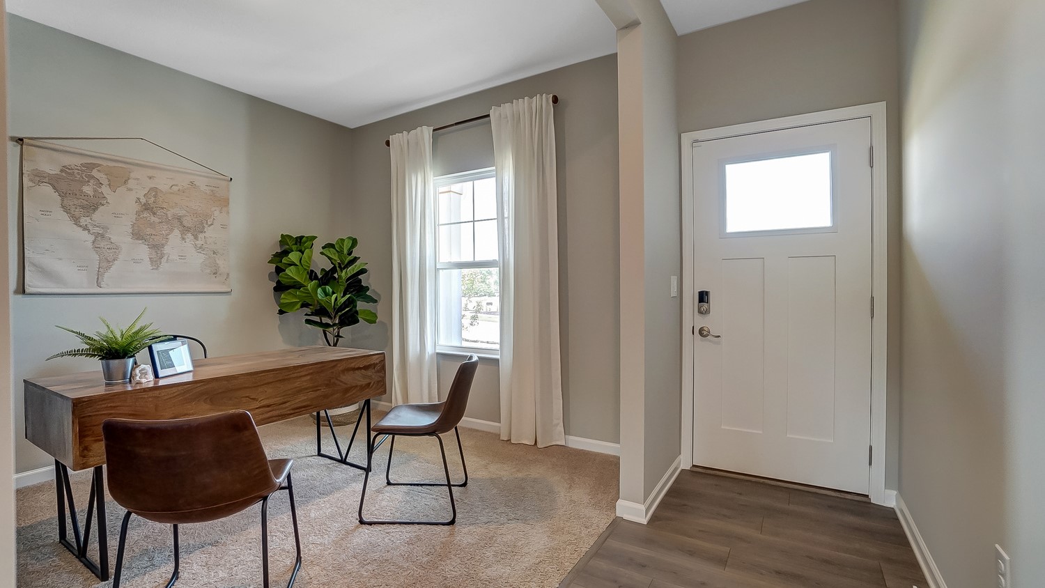 foyer with view of office and front door.