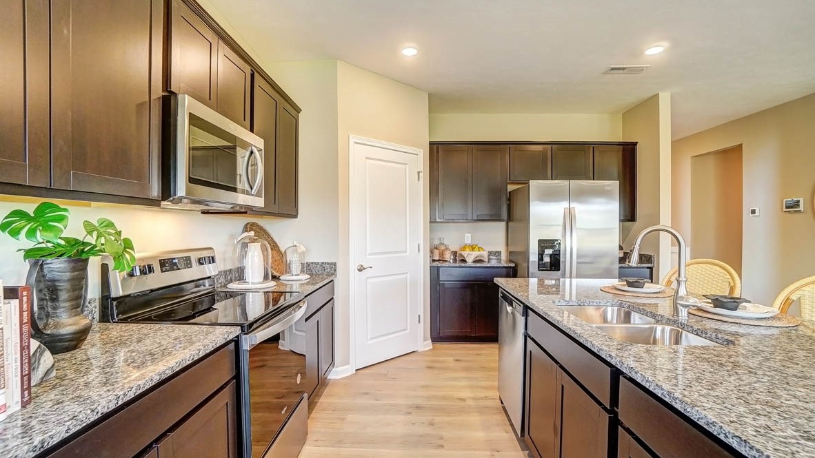 Kitchen with whirlpool stainless steel appliances and granite countertops