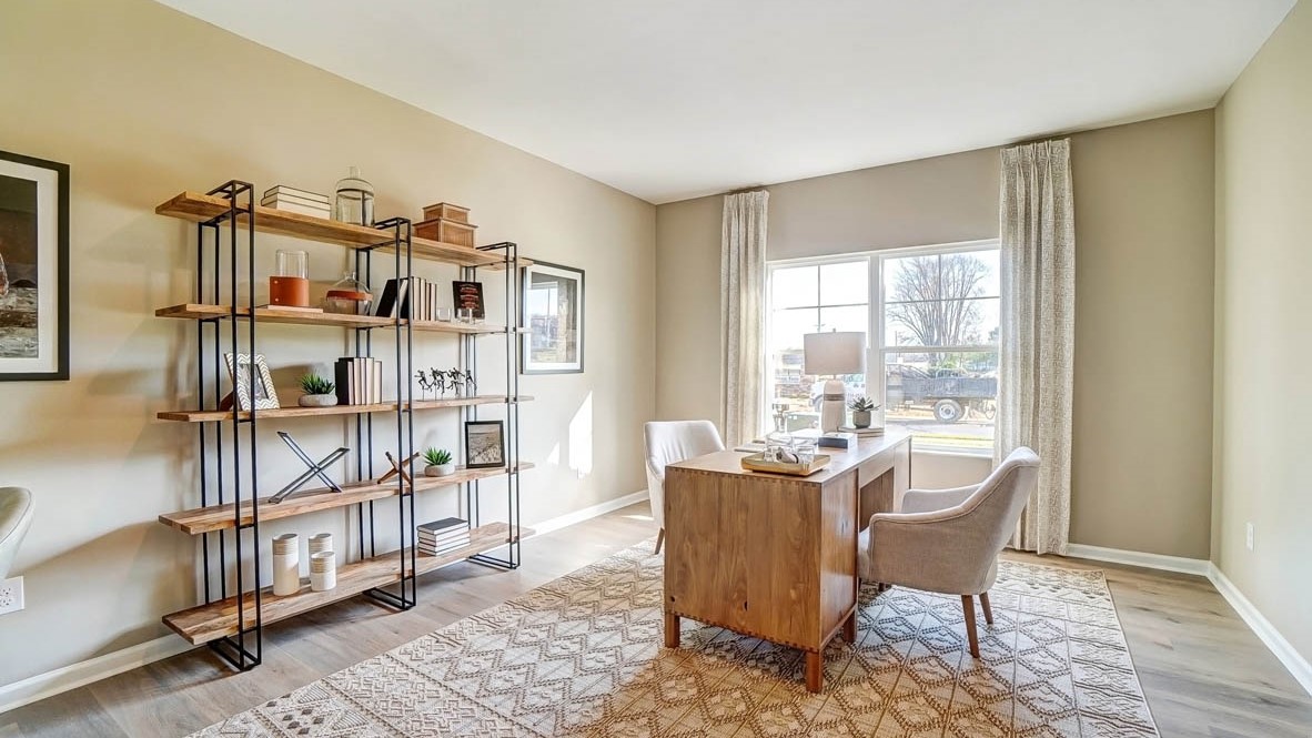 Corner view of desk and shelving in large office