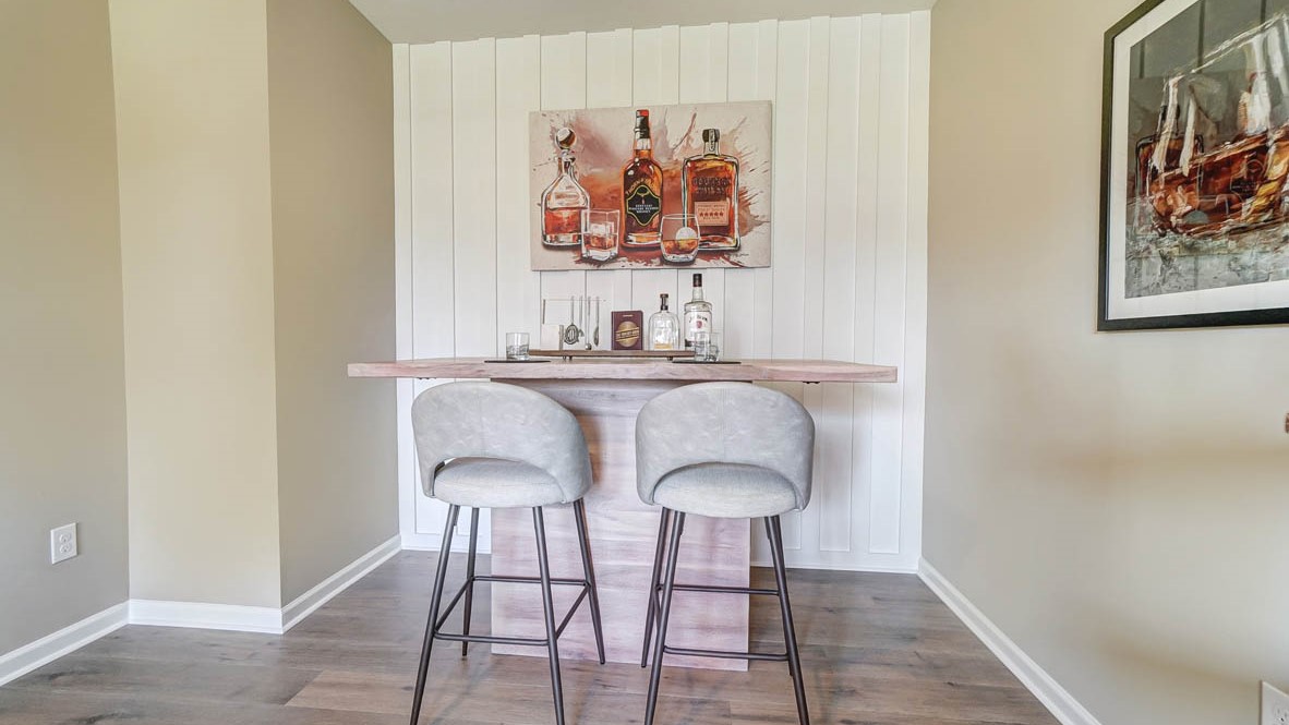 Bar with stools and whiskey décor.