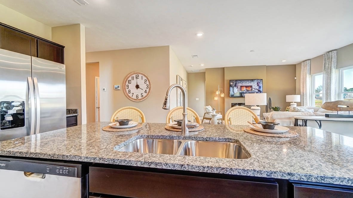 Open concept kitchen and living room with double sink