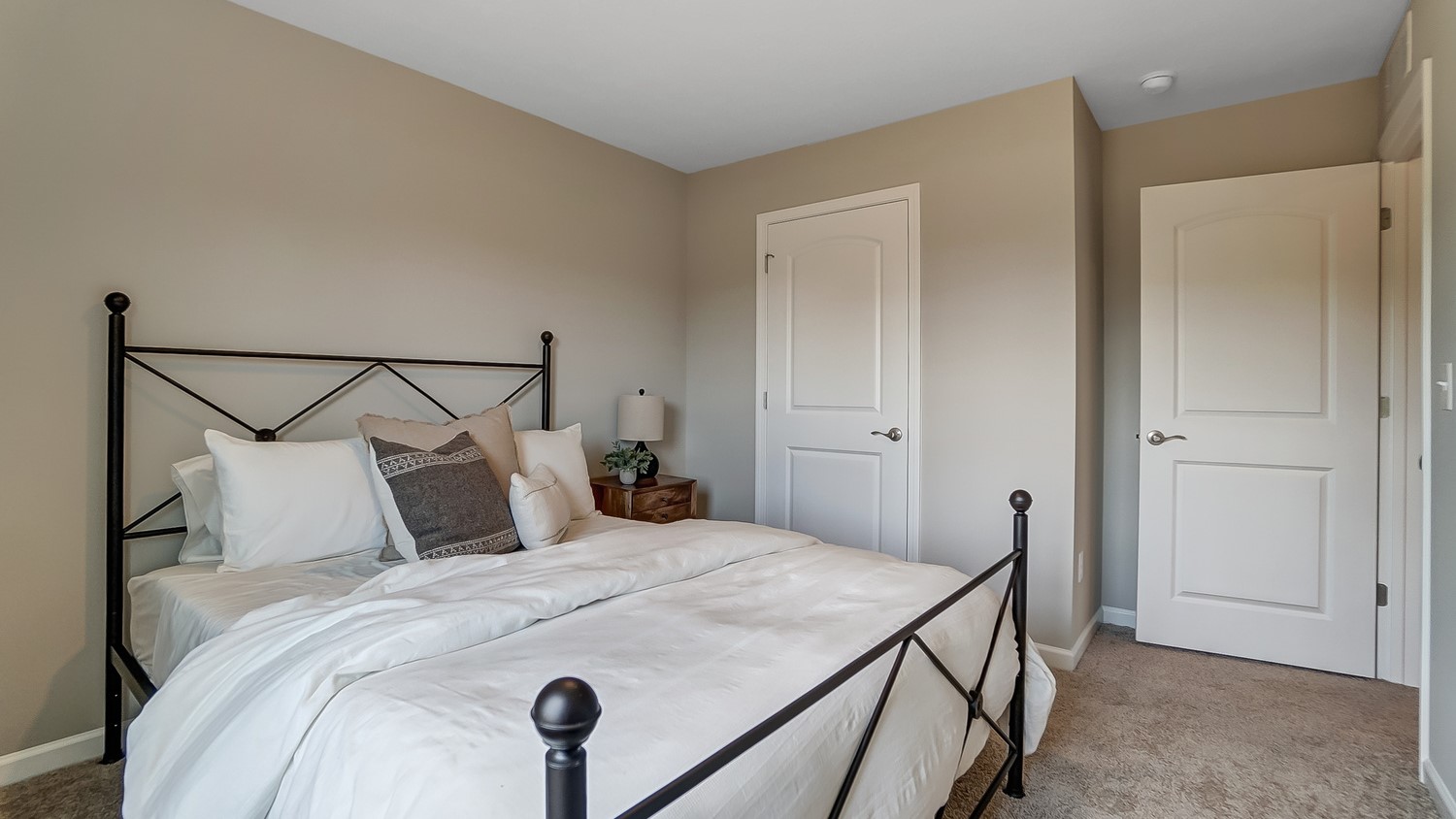 Bedroom 2 with beautiful bed and modern art.