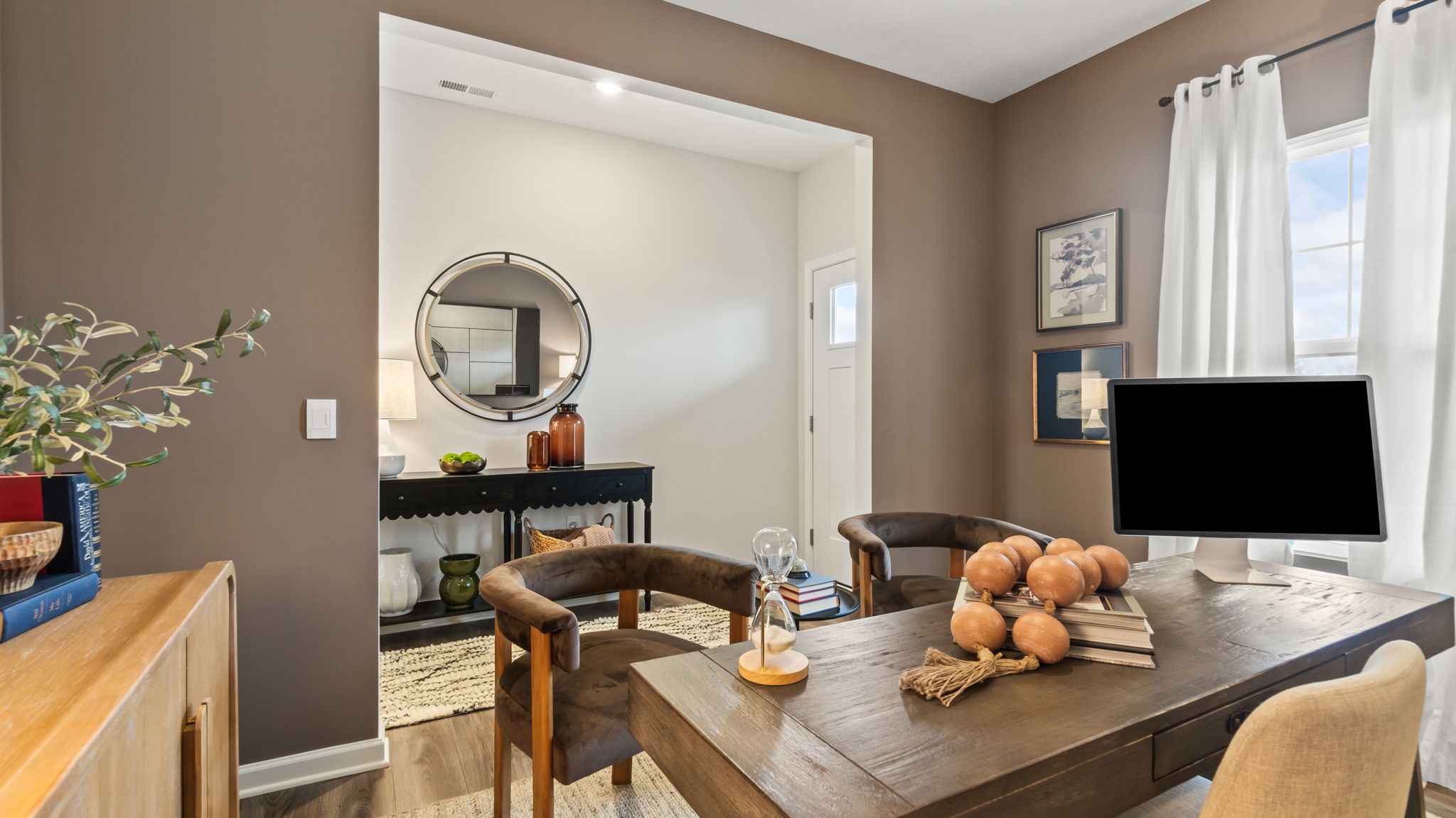 Office room from behind the primary desk peering into the hallway.