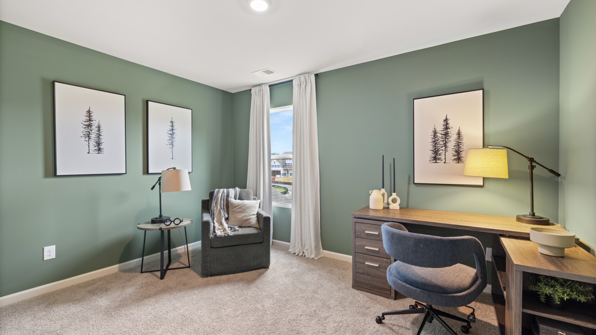 Flex room arranged as an office space with tree contemporary art, single-seater couch,