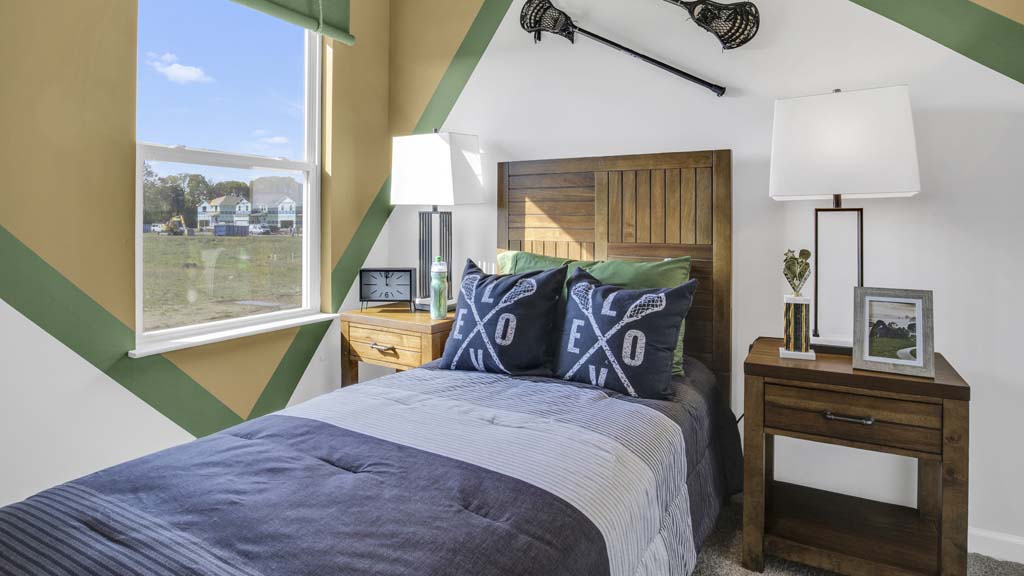 close up on bed in lacrosse themed room.