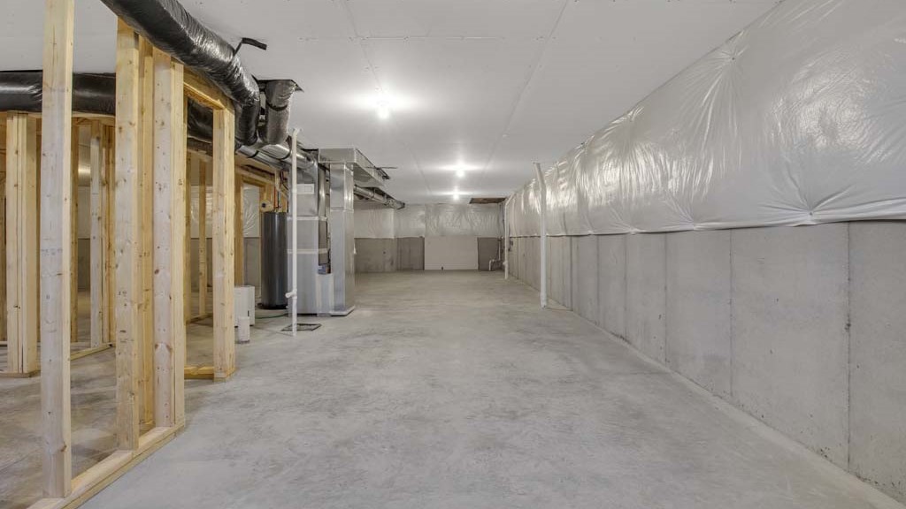 basement showing bathroom rough in and mechanical systems.