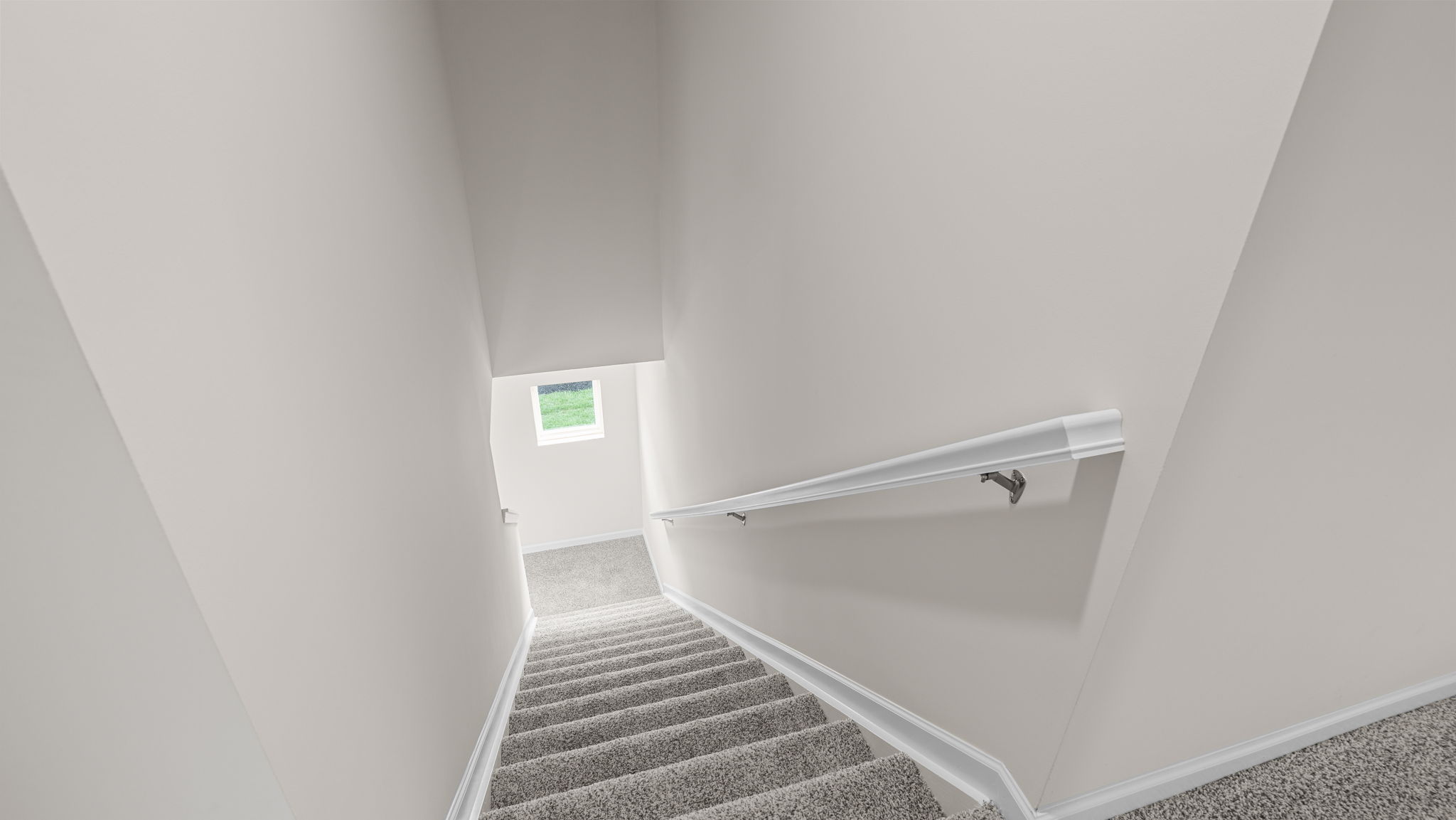 Carpeted stairs with side rails.