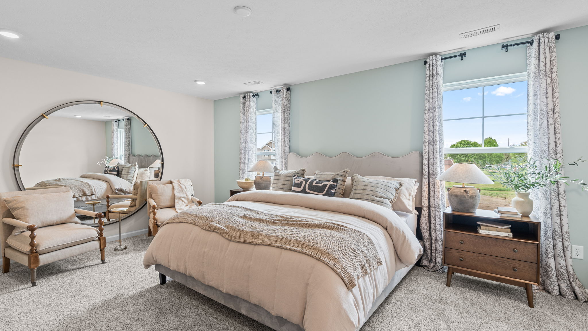 Primary bedroom with carpeted floors.