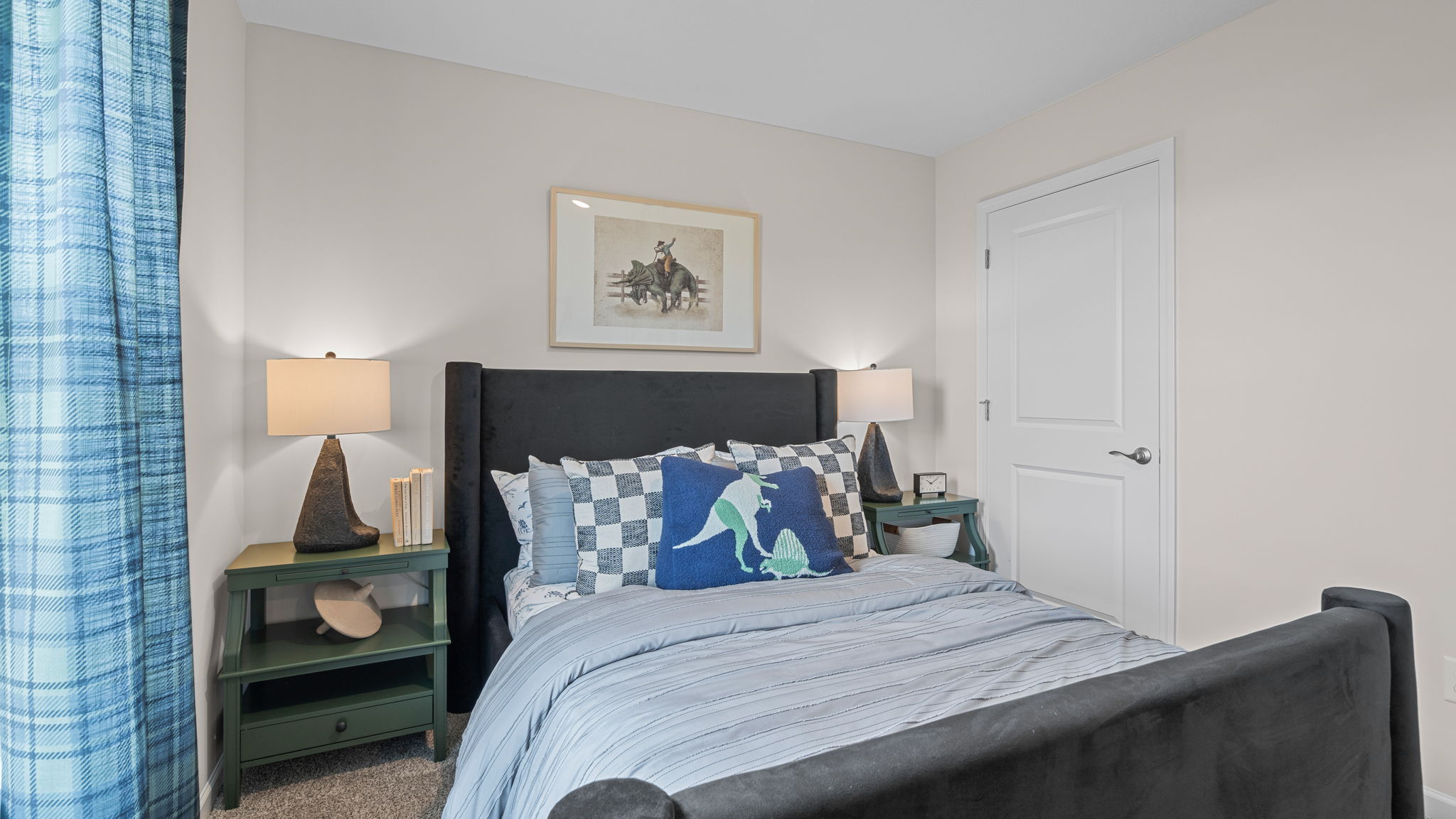 Bedroom with carpeted floors and closet.