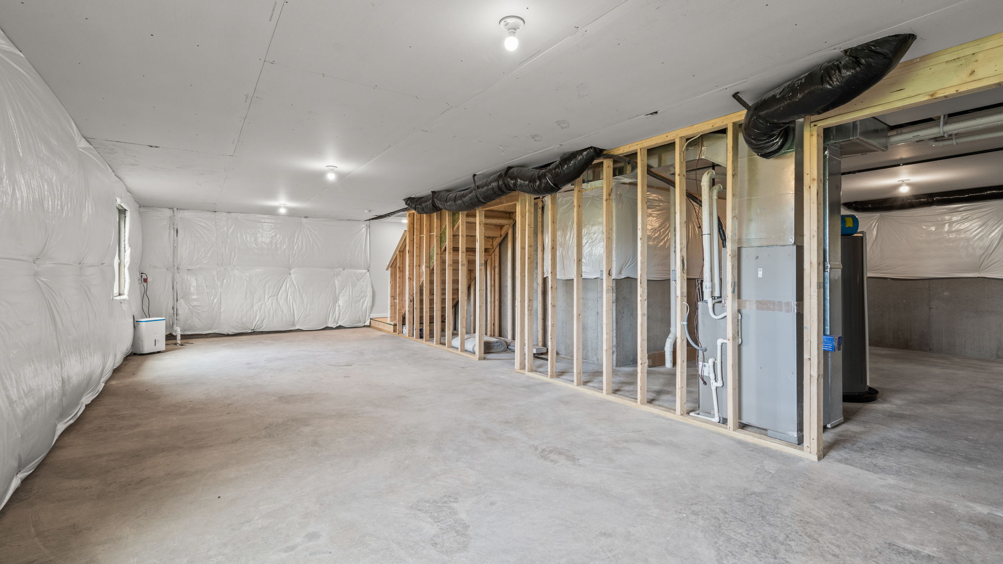 Basement with overhead lighting.
