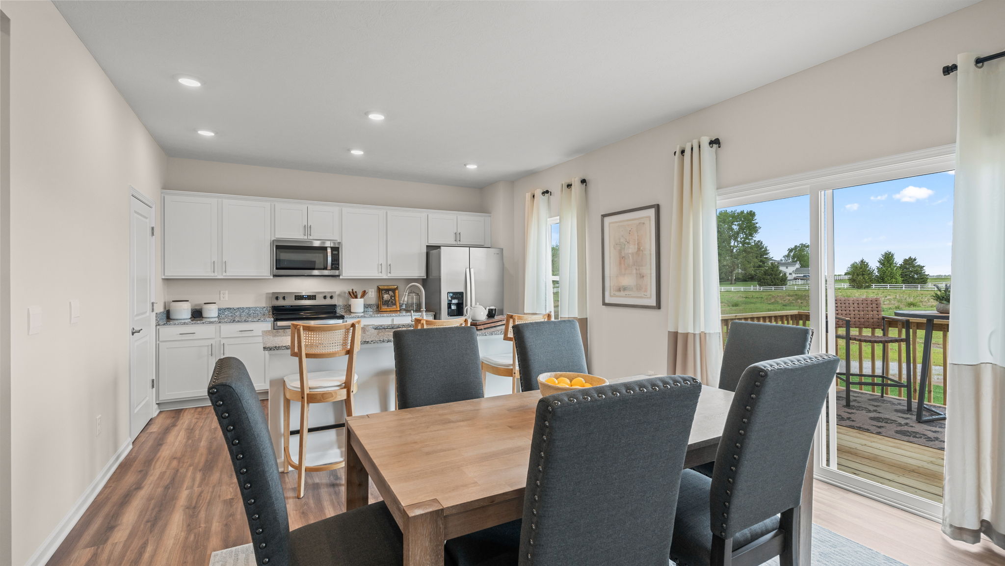 Dining area with glass sliding doors to back yard.