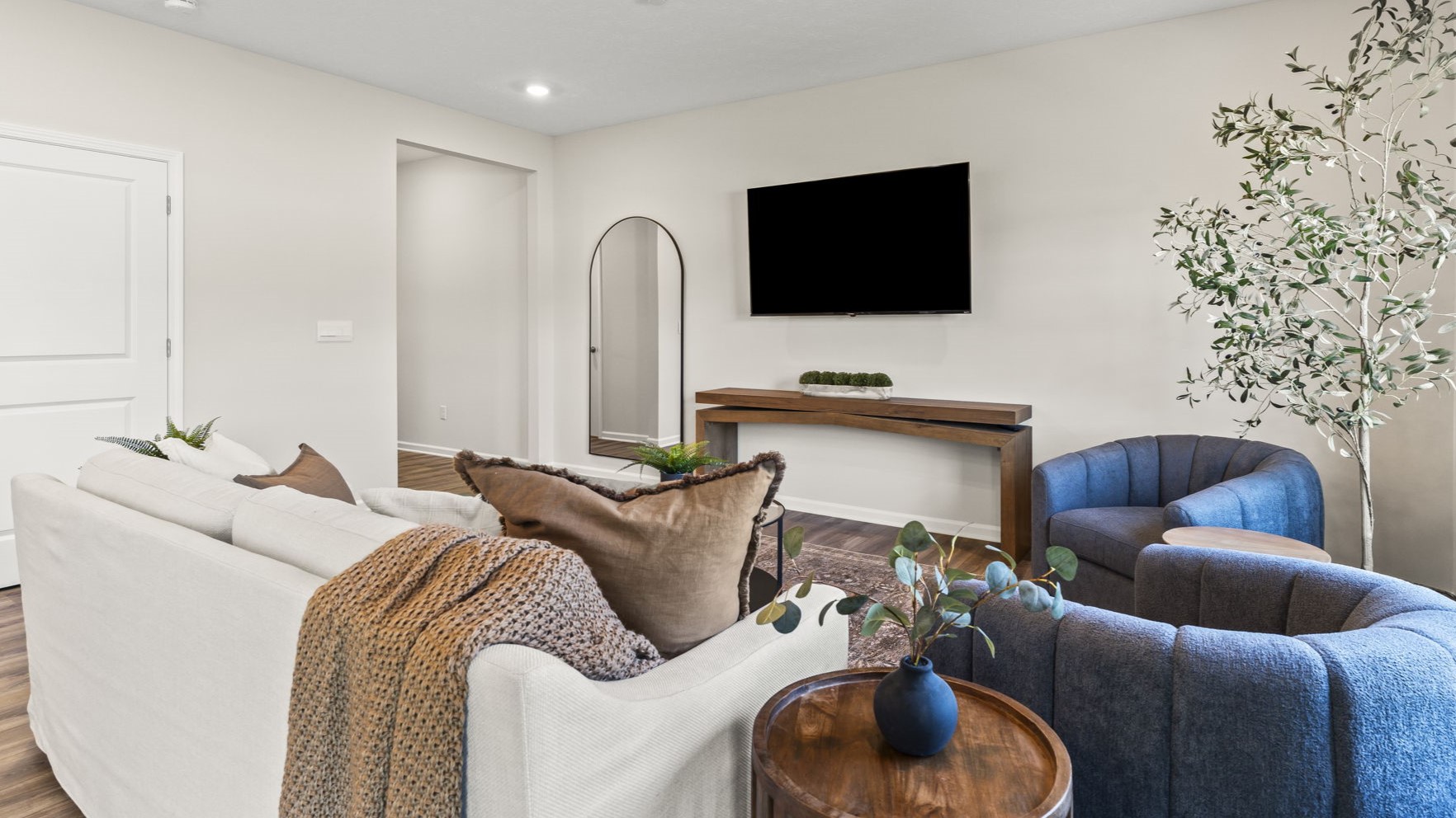 Living room with TV, center table, and modern furniture