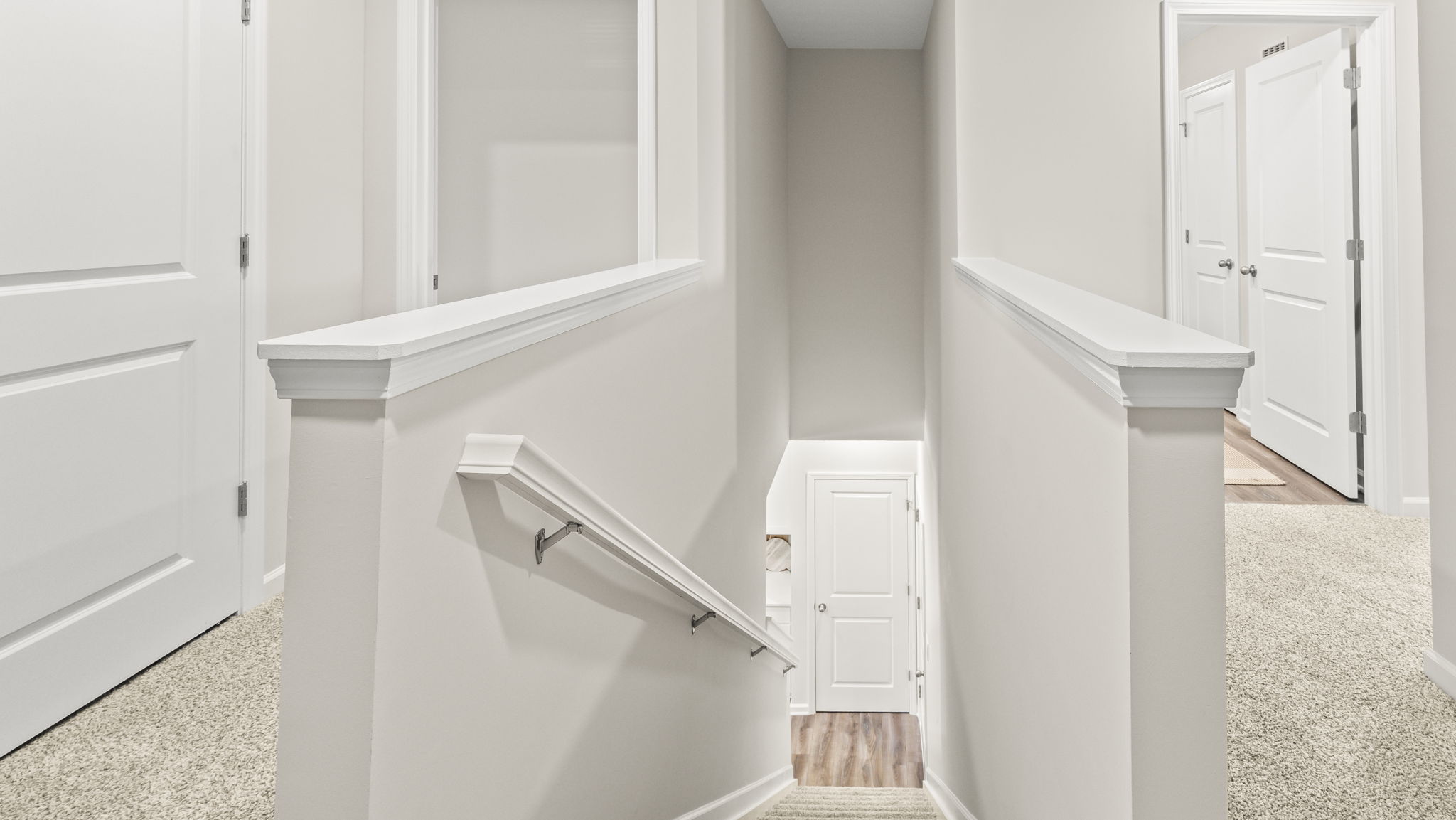 Upstairs looking into downstairs hallway