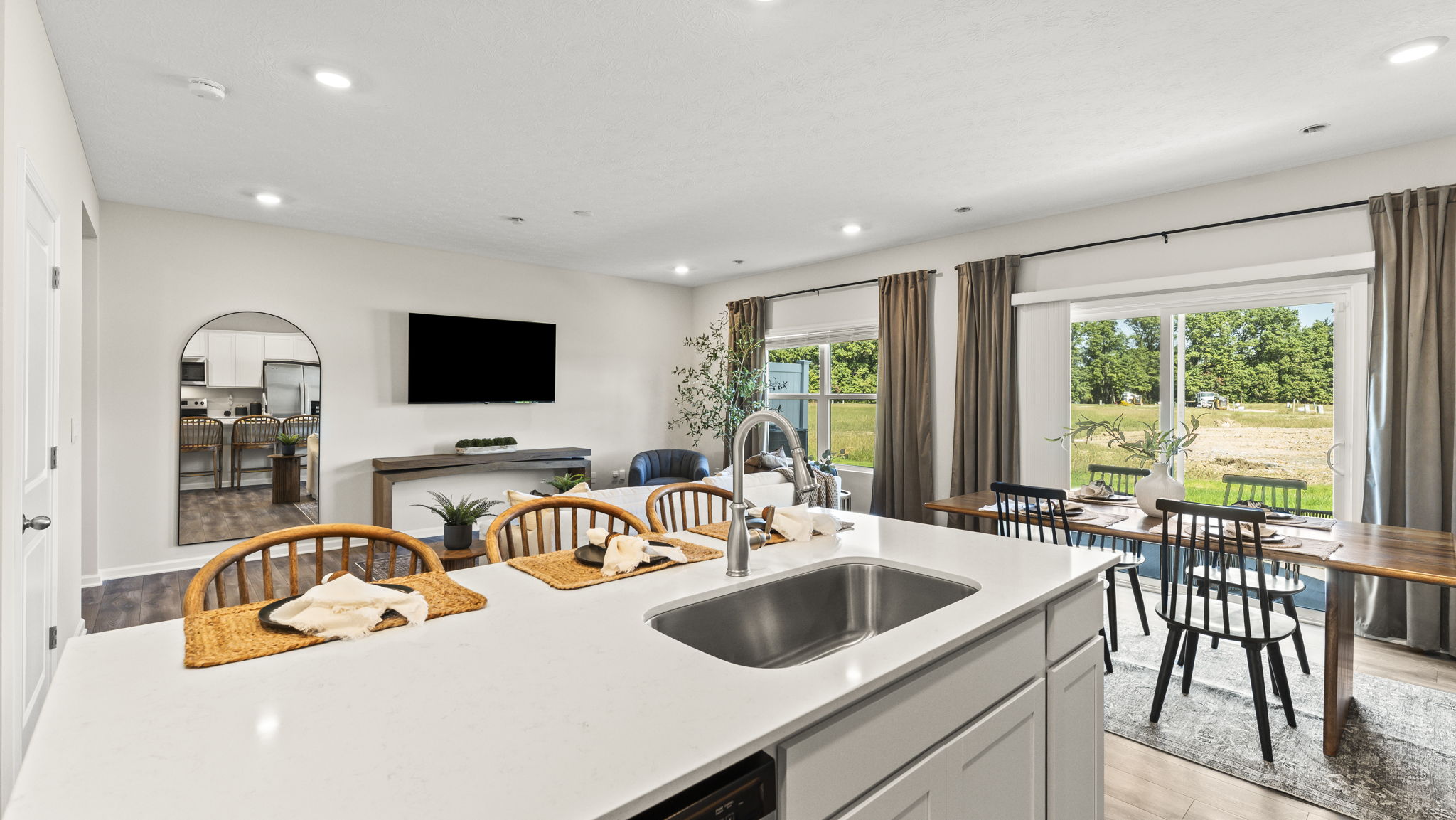 View from the kitchen of the sink and living room