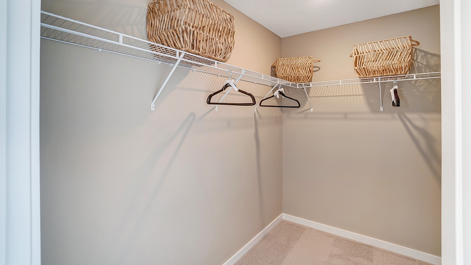 walk in closet with shelves.