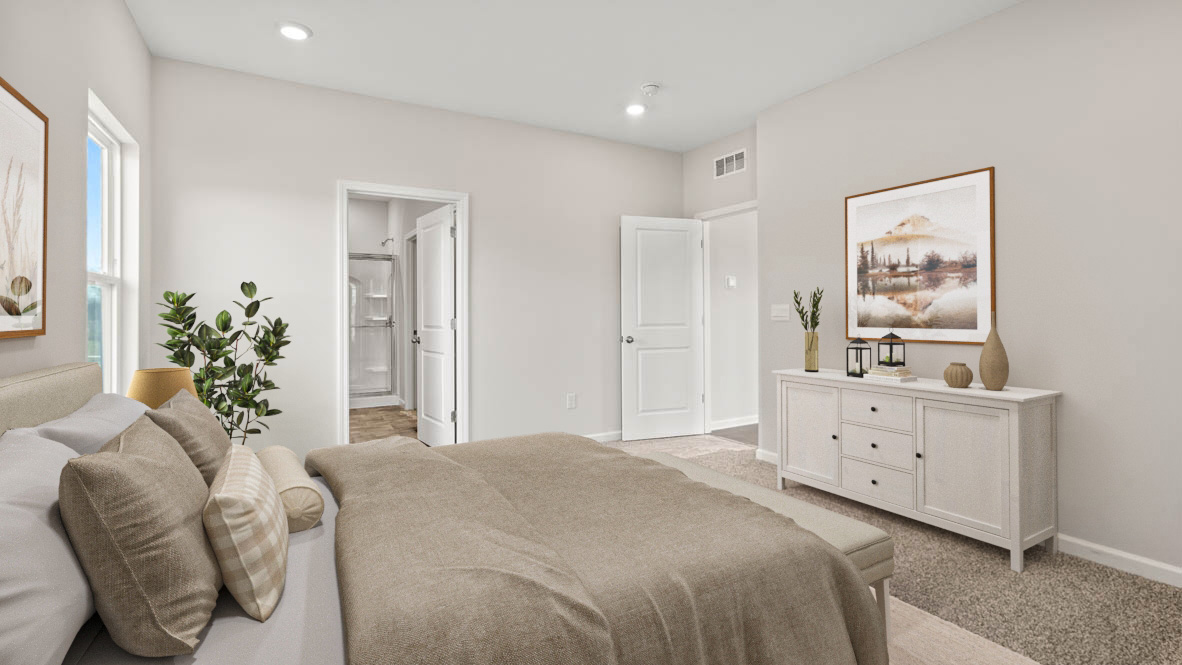 Primary bedroom with Modern art and private bathroom.