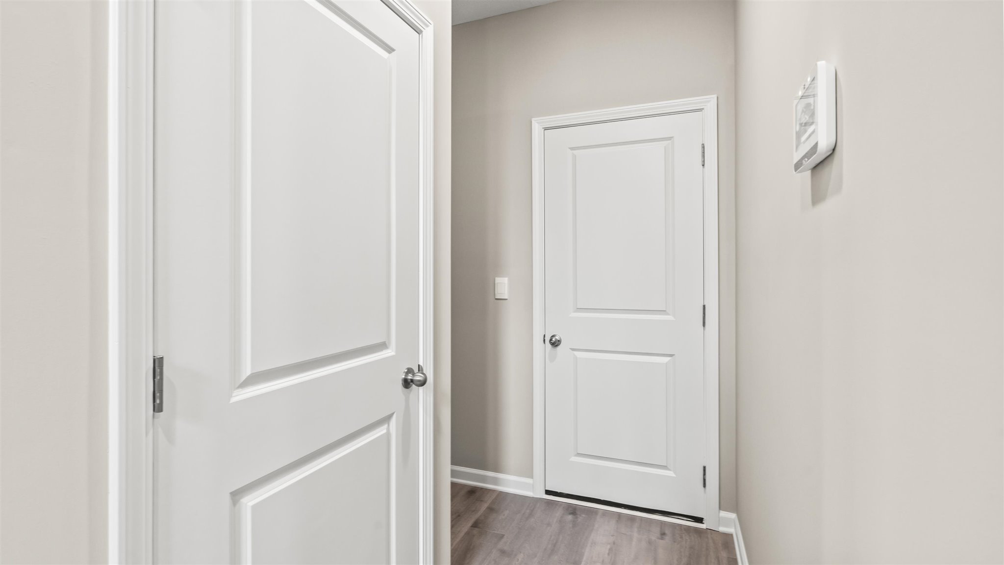 mud room with closet for storage and door to garage.