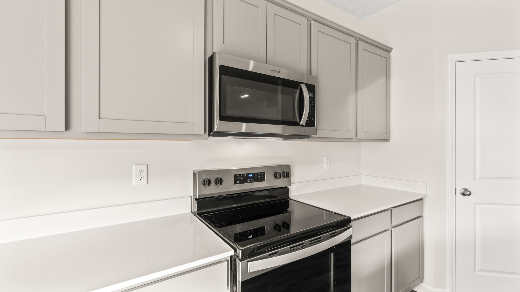 Closeup of countertops and oven range.