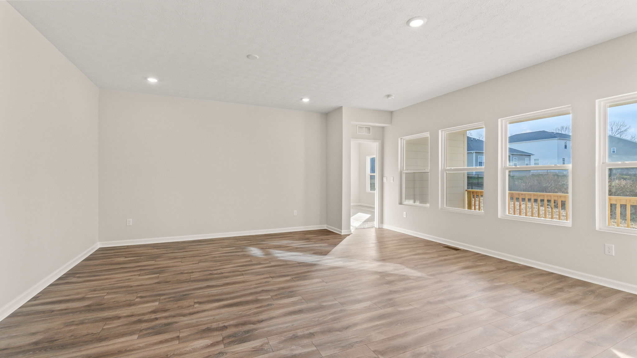 Full great room with window and natural lighting.