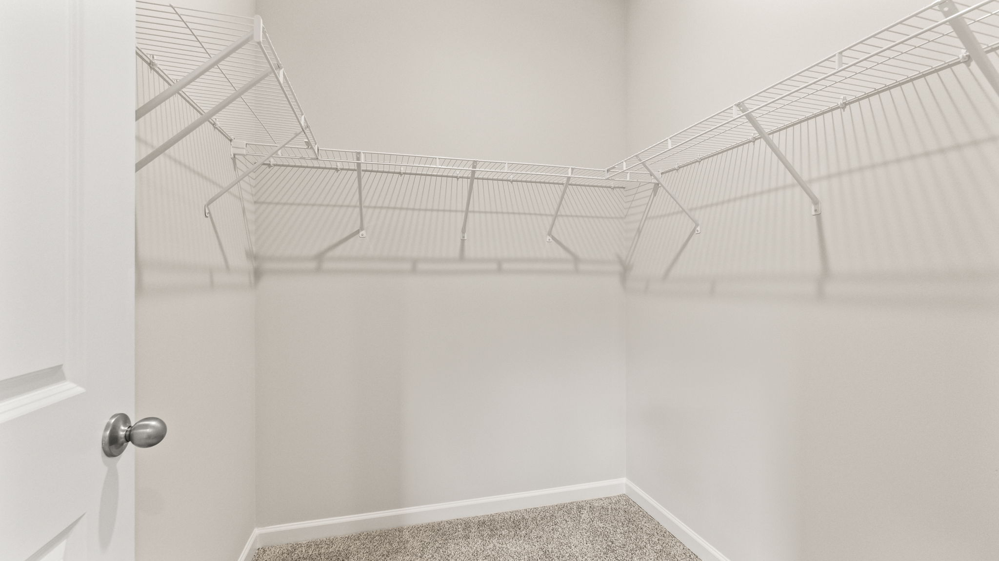 Walk-in closet with wire rack shelving