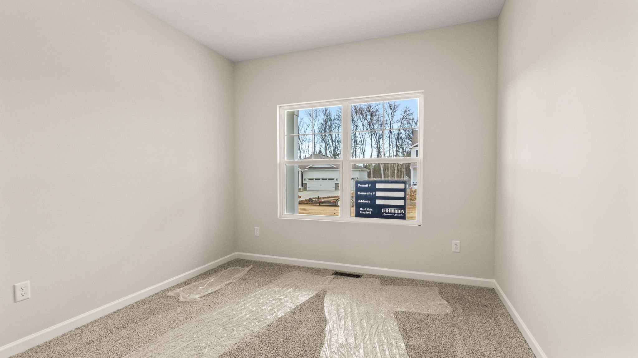 Carpeted bedroom with window