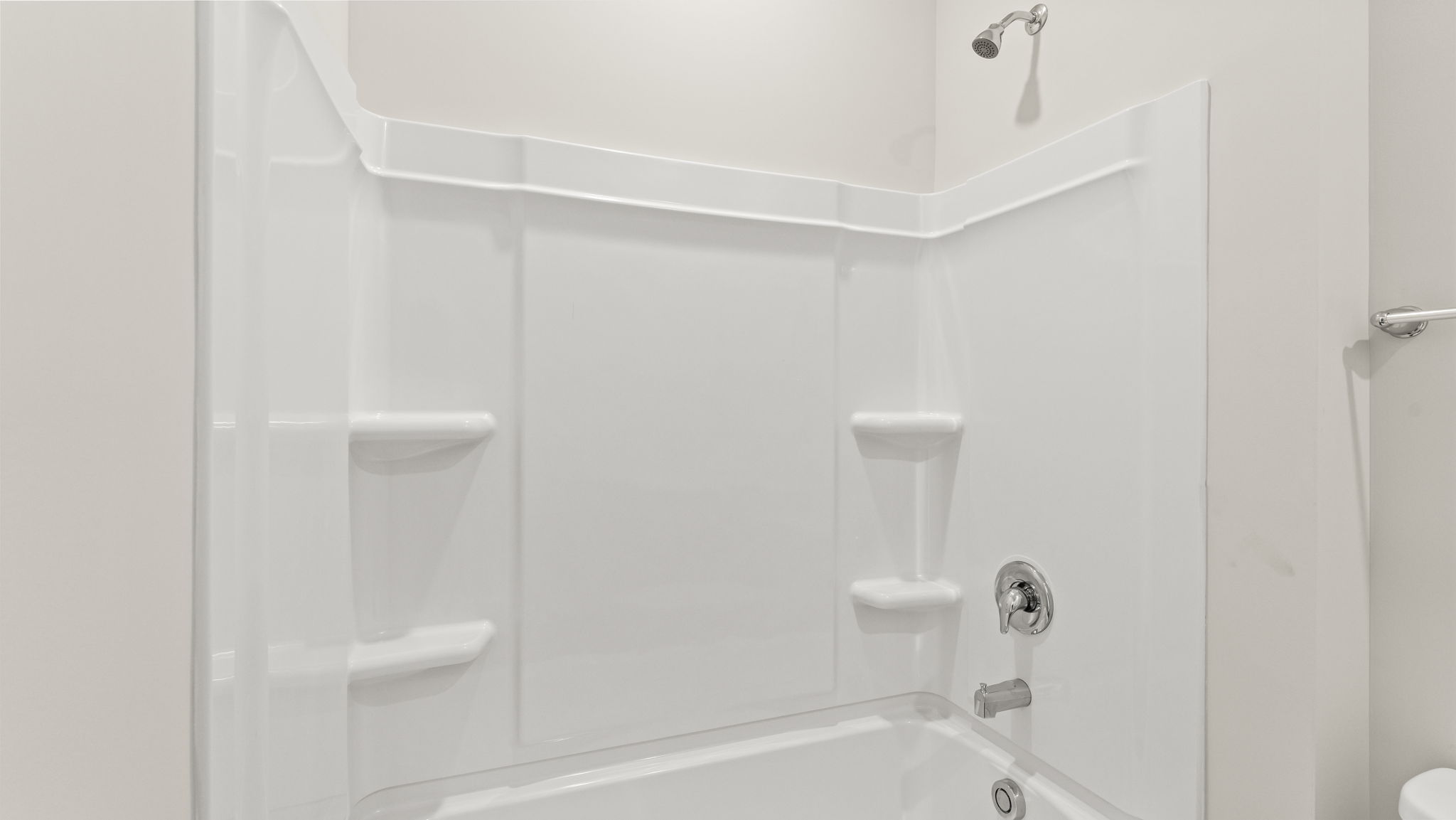 Closeup of tub with shelving