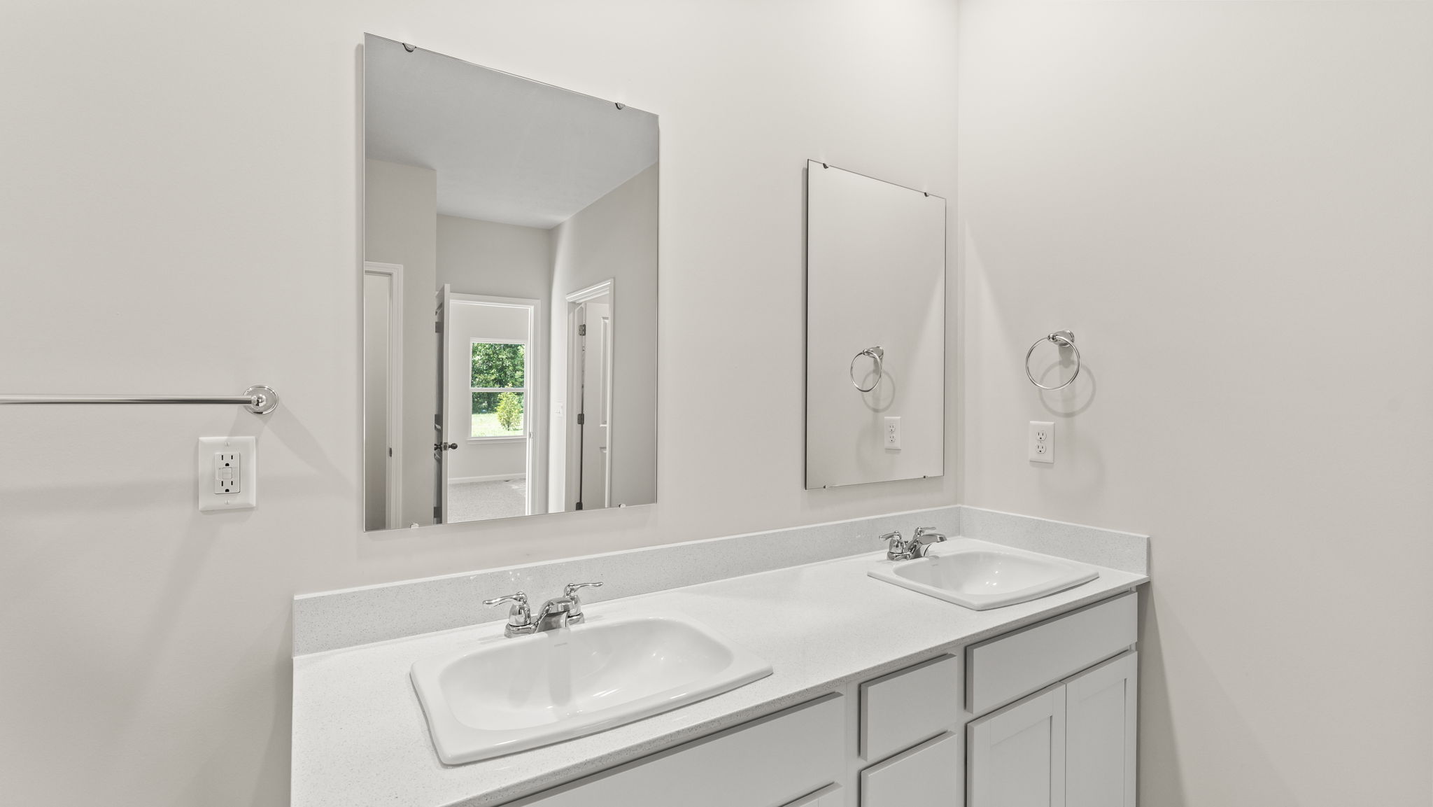 Dual-sink bathroom vanity with mirrors