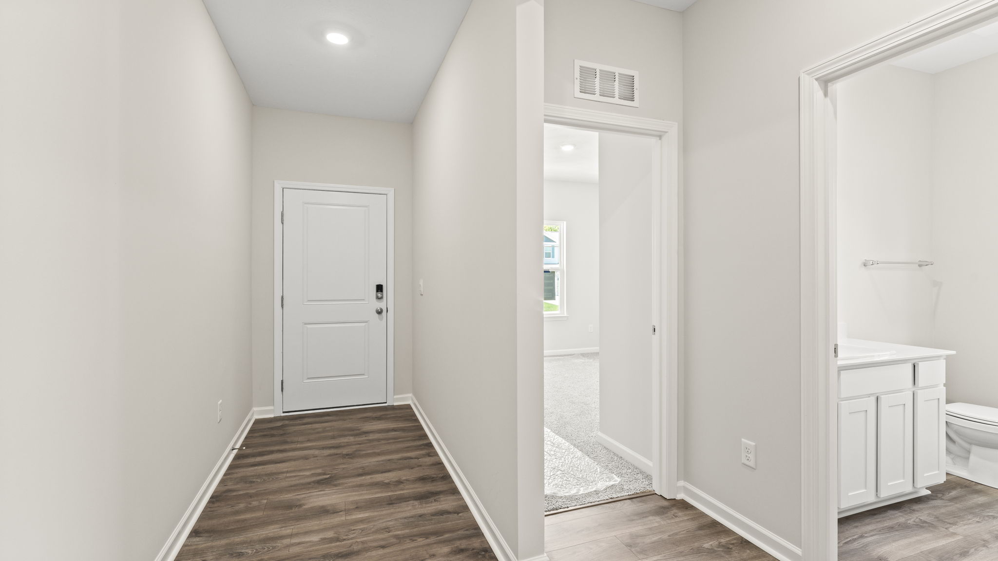 Front door of home next to bedroom
