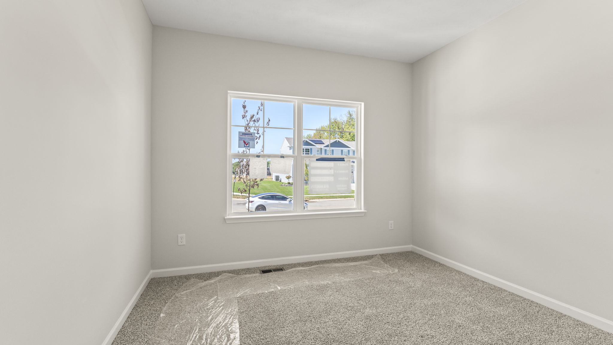 Carpeted bedroom with window