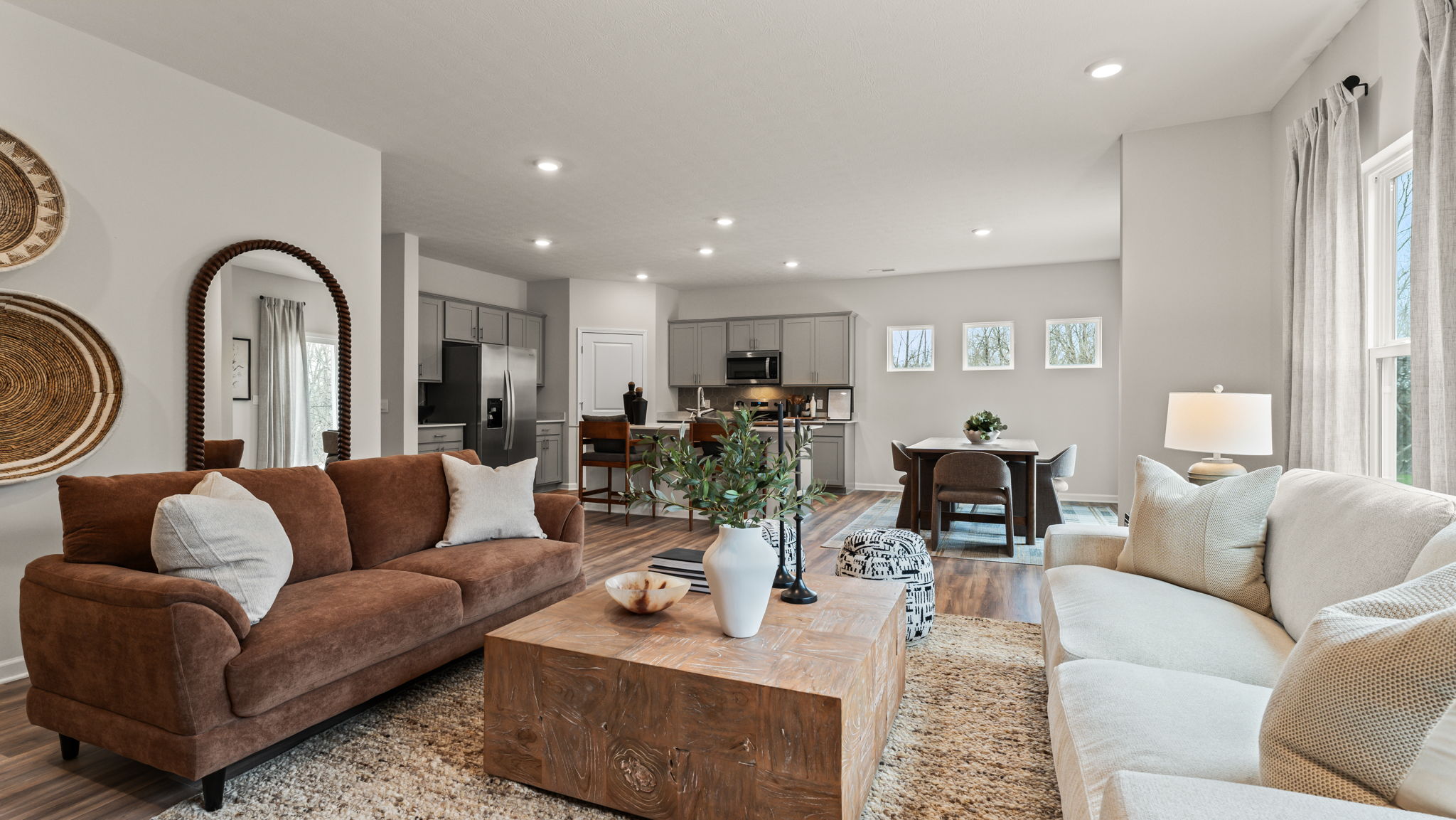 Great room with homey open-concept vibe and warm tones.