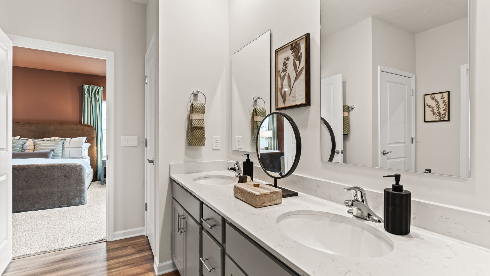 Closeup of double bowl vanity in primary bathroom suite